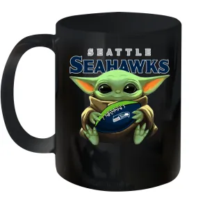 Baby Yoda Loves The Seattle Seahawks Star Wars Baby Yoda Hugs Seahawks NFL Ceramic Mug 11oz